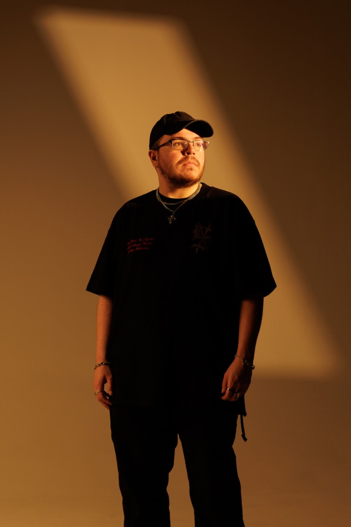 Ray Volpe sun kissed portrait, with orange hue behind him