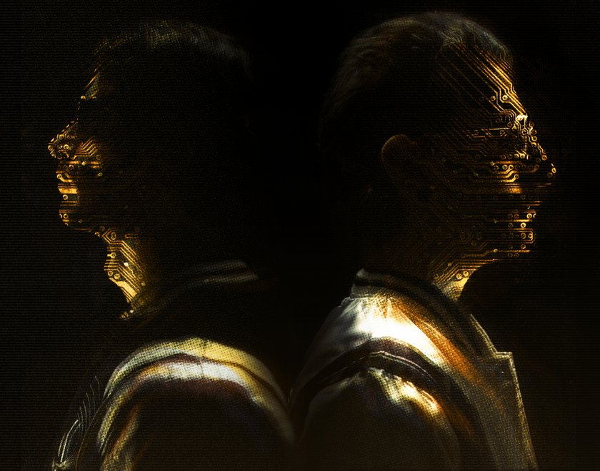 gold plated Kasablanca facing away from each other upon a black background