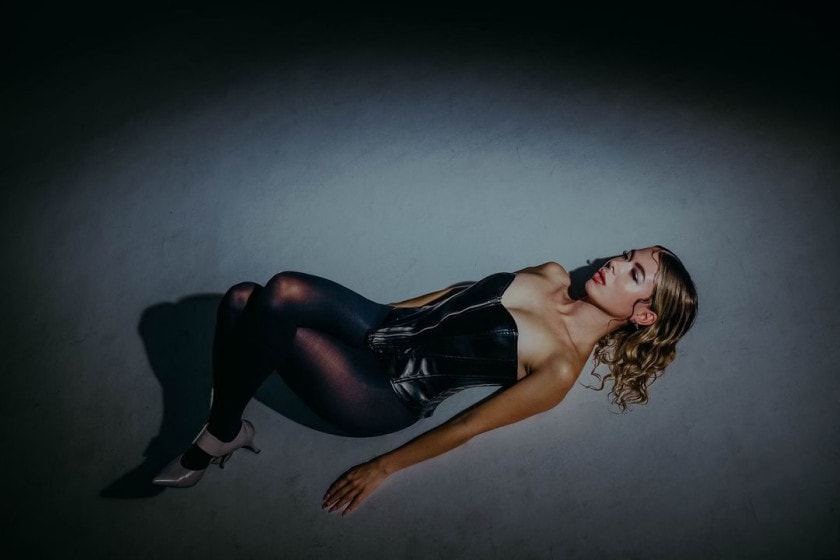 whipped cream lying down in balck leather
