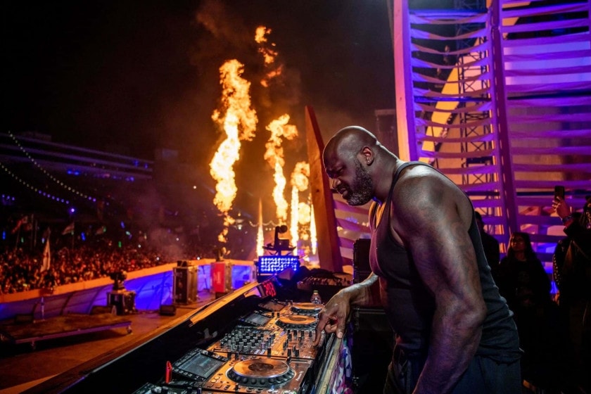 DJ DIESEL djing with fire in the background
